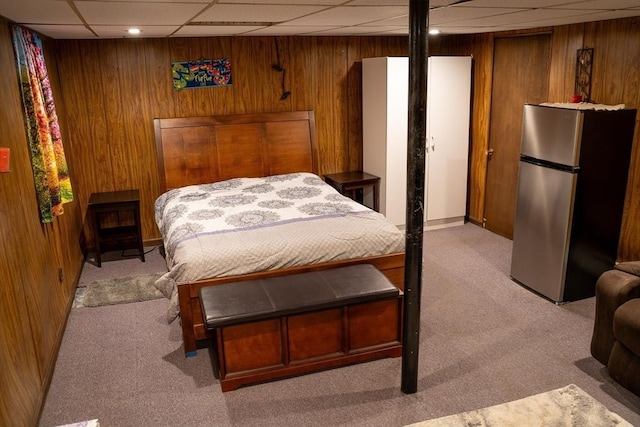 89 Audubon Ave, Braintree, MA 02184 - bedroom featuring freestanding refrigerator, light colored carpet, wooden walls, and a drop ceiling
