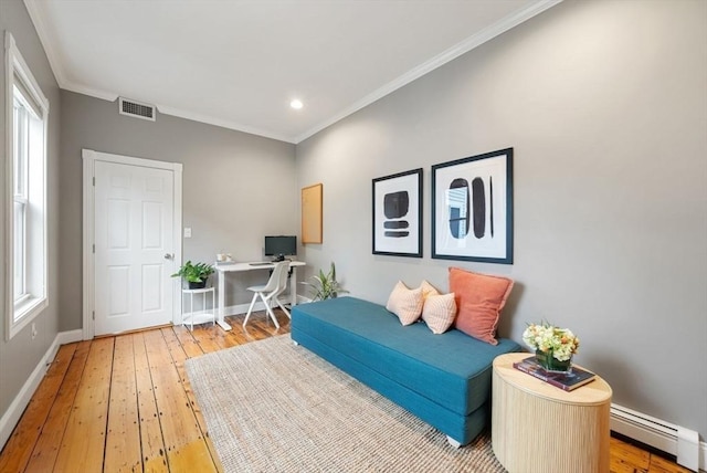 7 Trenton St Unit 2, Boston, MA 02129 - bedroom with baseboard heating, light wood-style flooring, crown molding, multiple windows, and baseboards