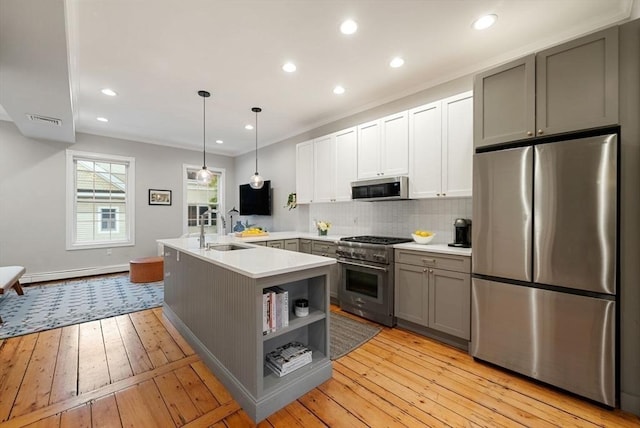 7 Trenton St Unit 2, Boston, MA 02129 - kitchen with stainless steel appliances, a sink, tasteful backsplash, gray cabinets, and light countertops