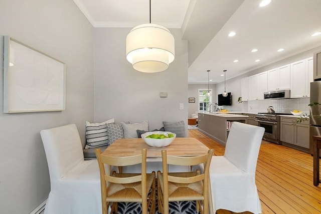 7 Trenton St Unit 2, Boston, MA 02129 - dining area featuring crown molding, light wood finished floors, recessed lighting, and a baseboard radiator