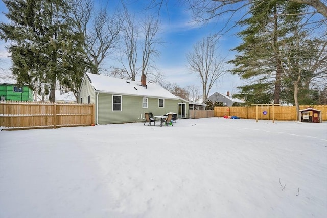 view of snow covered house