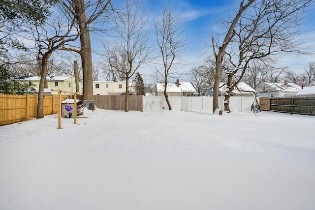 view of yard layered in snow