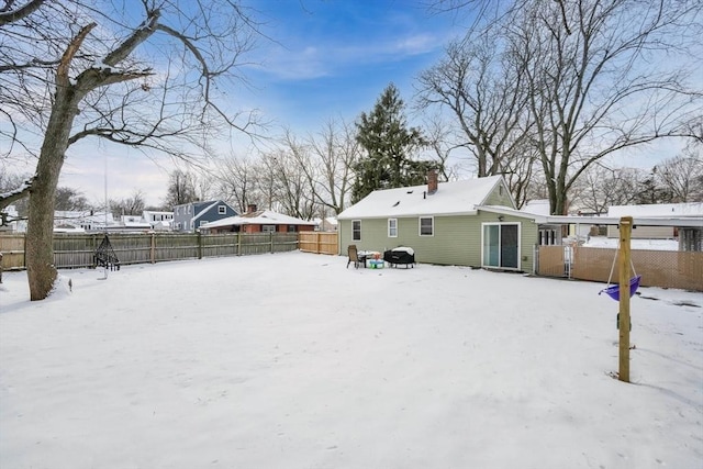 view of snow covered house