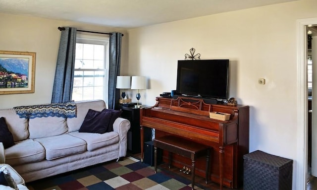living area with tile patterned floors