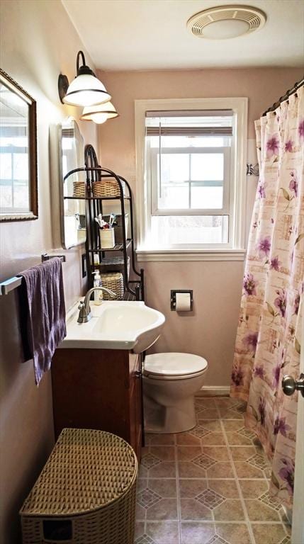 full bath featuring vanity, tile patterned flooring, toilet, and a shower with shower curtain