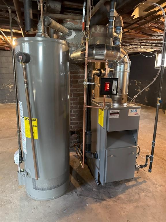 utility room with gas water heater