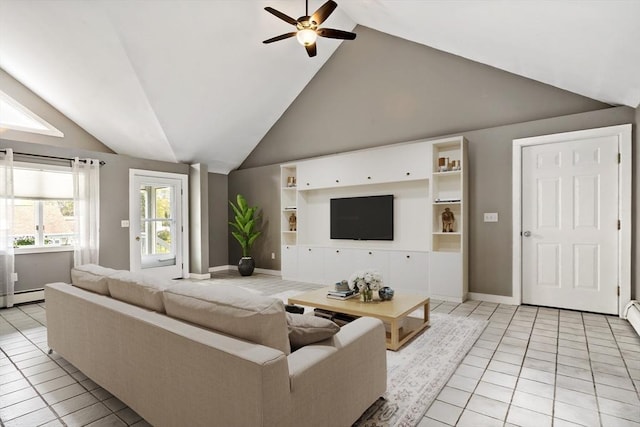 living room with a ceiling fan, vaulted ceiling, baseboards, a baseboard radiator, and light tile patterned flooring