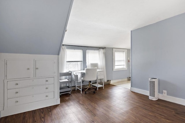 office space with baseboards, wood finished floors, and lofted ceiling