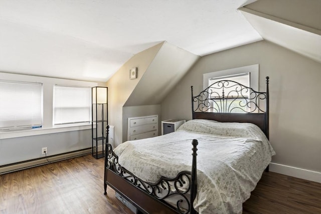 bedroom with baseboards, vaulted ceiling, and wood finished floors