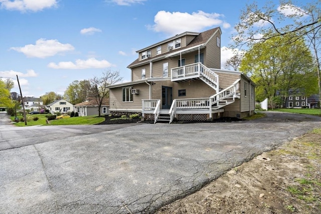 view of front of house featuring a wooden deck
