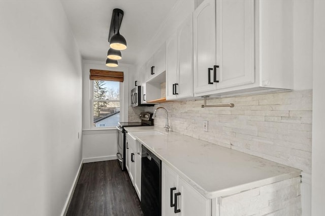 kitchen featuring appliances with stainless steel finishes, white cabinetry, backsplash, and dark wood-style floors