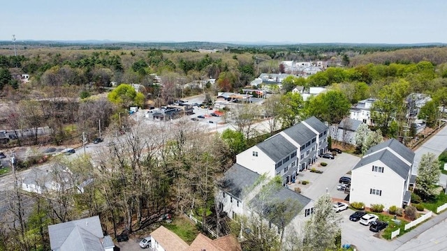 aerial view with a wooded view and a residential view