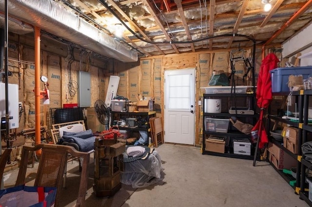 storage area featuring water heater and electric panel
