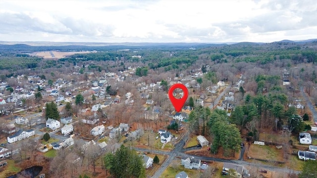 drone / aerial view featuring a forest view