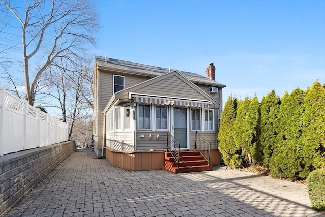 rear view of house with a patio