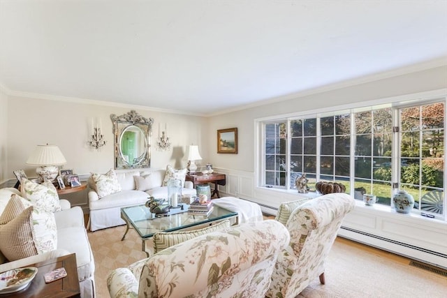 living room featuring crown molding and a baseboard heating unit