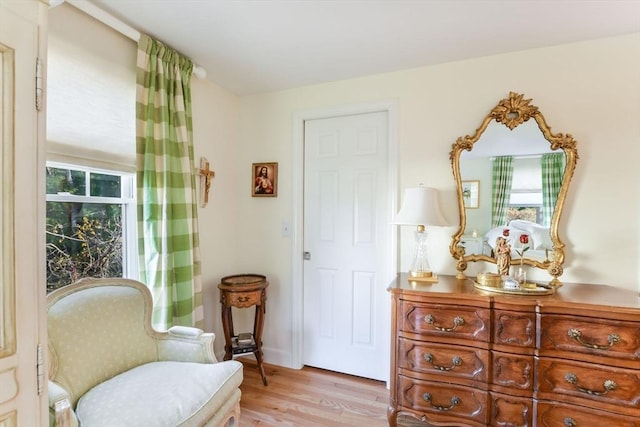 sitting room featuring light hardwood / wood-style flooring