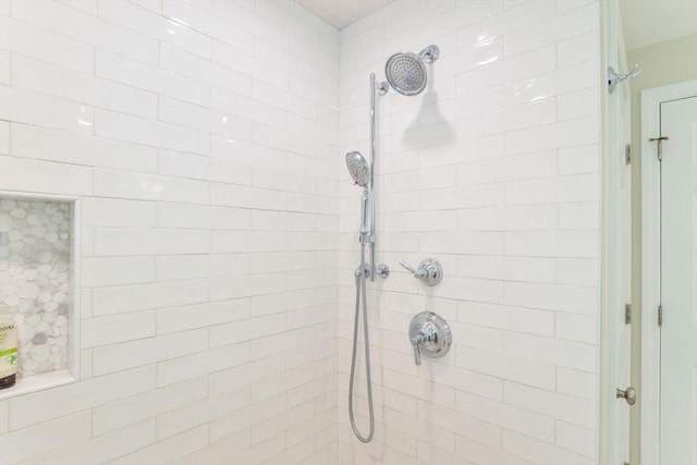 bathroom with a tile shower