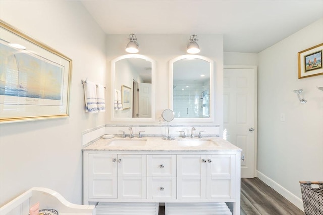 bathroom featuring vanity and wood-type flooring