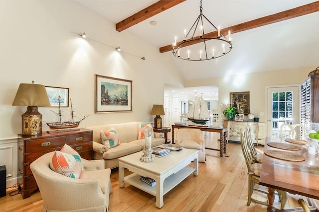 living room with high vaulted ceiling, light hardwood / wood-style flooring, baseboard heating, beam ceiling, and a chandelier