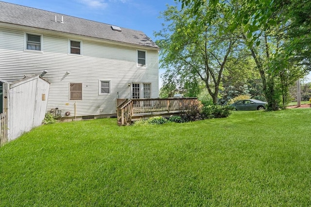 22 Washington St, Methuen, MA 01844 - rear view of property featuring a deck and a lawn