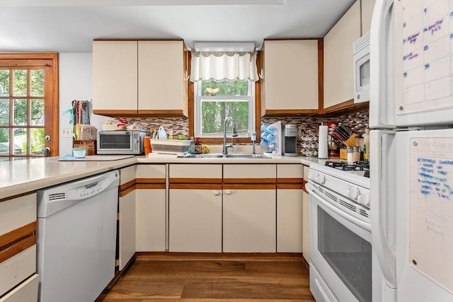 22 Washington St, Methuen, MA 01844 - kitchen featuring white appliances, wood finished floors, light countertops, and tasteful backsplash
