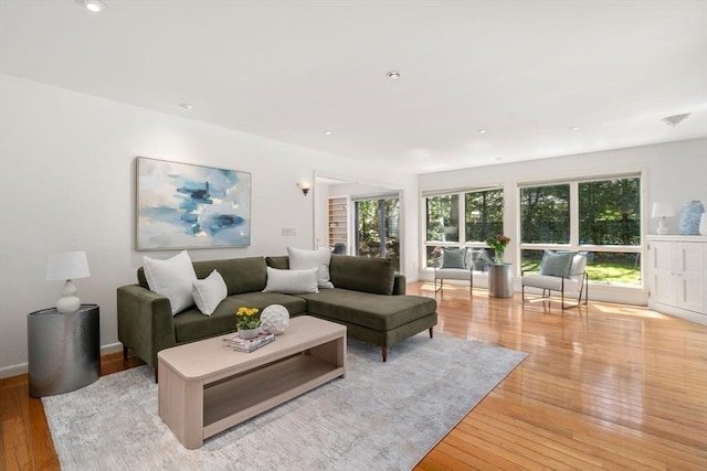 living room featuring recessed lighting and light wood-type flooring