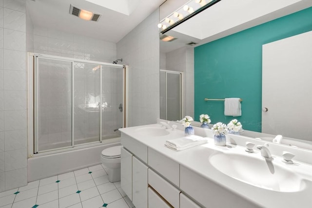 bathroom with visible vents, a sink, tile patterned floors, and toilet