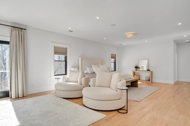 bedroom with access to exterior, recessed lighting, visible vents, light wood-style floors, and baseboards