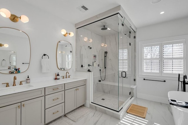 bathroom featuring double vanity, a stall shower, visible vents, marble finish floor, and a sink