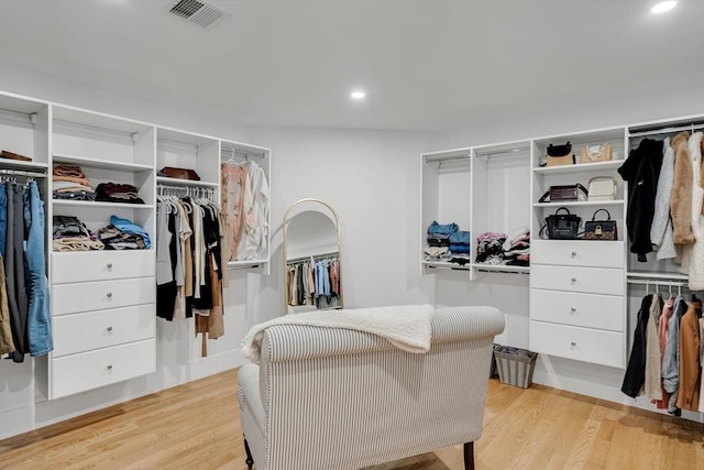 walk in closet featuring light wood-style flooring and visible vents