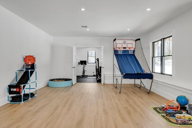 game room with recessed lighting, visible vents, and wood finished floors