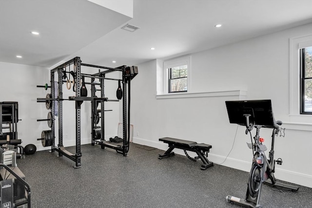 workout area with recessed lighting, visible vents, and baseboards