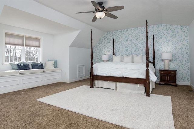 carpeted bedroom featuring ceiling fan, vaulted ceiling, and wallpapered walls