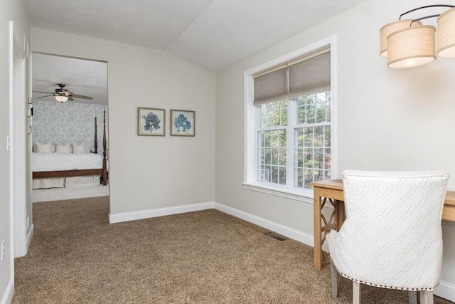 carpeted office featuring baseboards, a ceiling fan, lofted ceiling, and visible vents