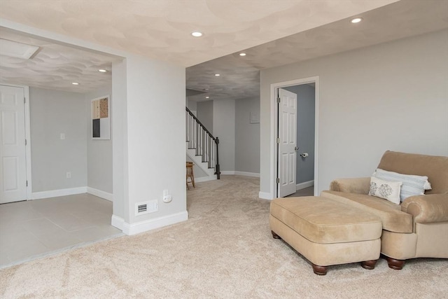 sitting room featuring visible vents, stairs, baseboards, carpet flooring, and recessed lighting