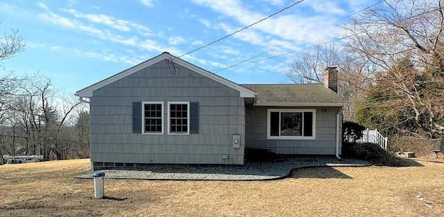 exterior space featuring a chimney