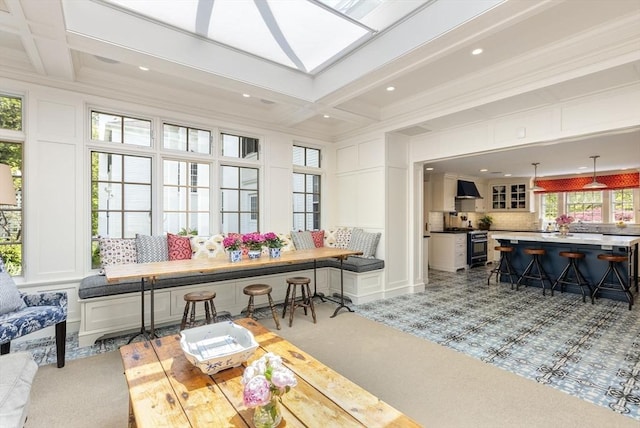 sunroom / solarium featuring coffered ceiling and beam ceiling