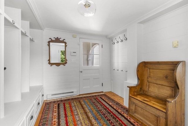 mudroom featuring ornamental molding, wood finished floors, and a baseboard heating unit