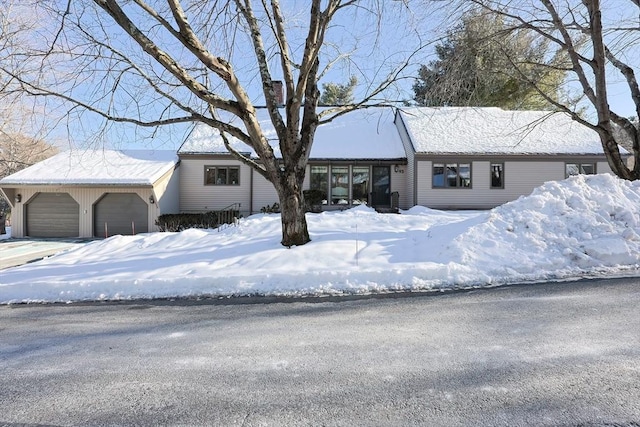 ranch-style house with a detached garage