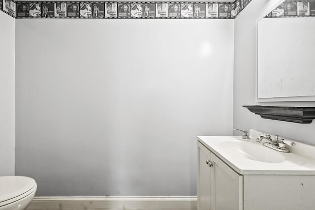 231 Georgetown Rd, Boxford, MA 01921 - bathroom featuring toilet, vanity, and baseboards