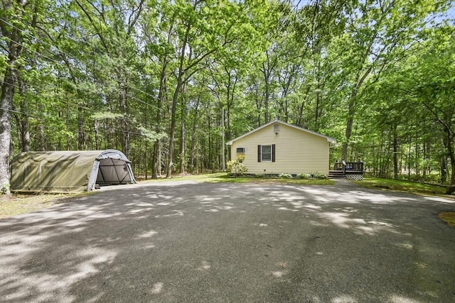231 Georgetown Rd, Boxford, MA 01921 - view of property exterior with a wooden deck and a forest view