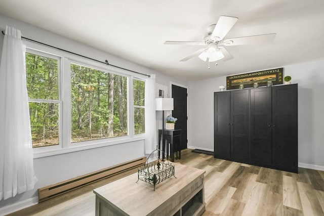 231 Georgetown Rd, Boxford, MA 01921 - living area with baseboard heating, a ceiling fan, light wood-style floors, and baseboards