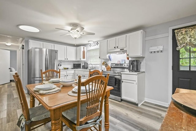 231 Georgetown Rd, Boxford, MA 01921 - dining space featuring ceiling fan, light wood finished floors, and baseboards