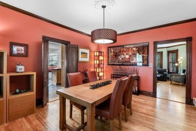 5 Willow Ave, Somerville, MA 02144 - dining area with ornamental molding and light wood-style flooring