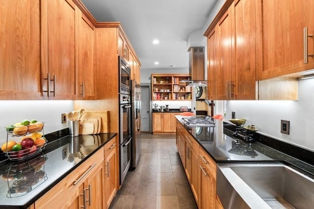 5 Willow Ave, Somerville, MA 02144 - kitchen with open shelves, appliances with stainless steel finishes, dark stone counters, recessed lighting, and brown cabinets