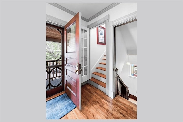 5 Willow Ave, Somerville, MA 02144 - stairway with wood finished floors, baseboards, and crown molding