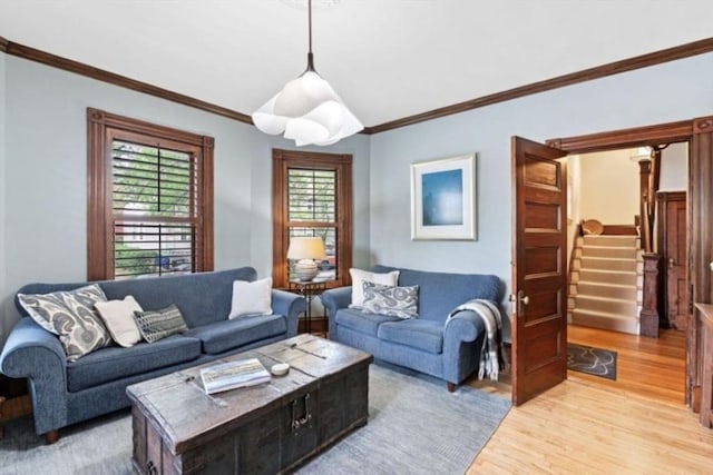 5 Willow Ave, Somerville, MA 02144 - living room with light wood-style flooring, ornamental molding, and stairway