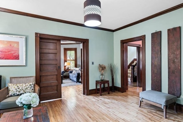5 Willow Ave, Somerville, MA 02144 - living area featuring crown molding, light wood-type flooring, and baseboards