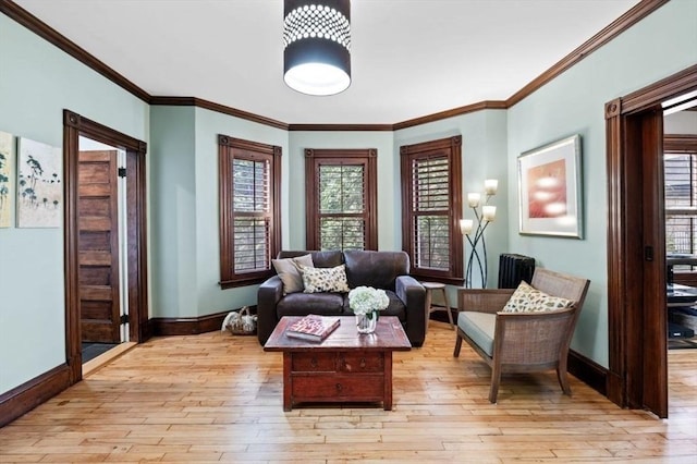 5 Willow Ave, Somerville, MA 02144 - sitting room featuring baseboards, light wood finished floors, and crown molding